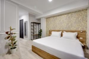 Letto o letti in una camera di Regraph Hotel