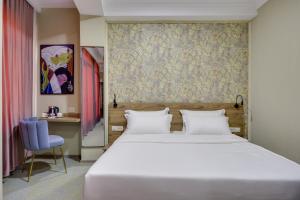 Letto o letti in una camera di Regraph Hotel