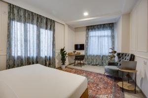 Letto o letti in una camera di Regraph Hotel