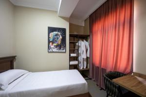 Letto o letti in una camera di Regraph Hotel