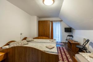 Postel nebo postele na pokoji v ubytování Casa Panorama Sovata