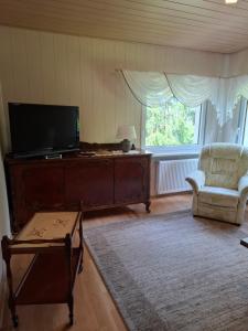 TV a/nebo společenská místnost v ubytování Ferienwohnung Böhme Aue