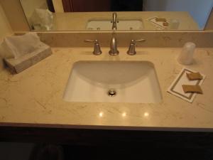 a bathroom sink with christmas lights on it at Al's Westward Ho Motel in West Yellowstone