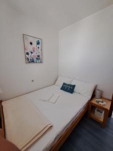 Postel nebo postele na pokoji v ubytování Apartments Galović