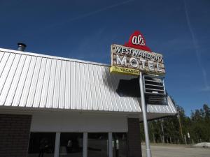 a sign for a westward mo motel on top of a building at Al's Westward Ho Motel in West Yellowstone