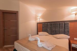 Postel nebo postele na pokoji v ubytování Lara Boutique