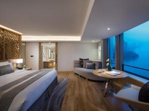 Ένα ή περισσότερα κρεβάτια σε δωμάτιο στο White Swan Hotel