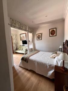 Postel nebo postele na pokoji v ubytování La Casona de Villanueva de Pría