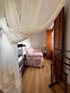 Postel nebo postele na pokoji v ubytování La Casona de Villanueva de Pría