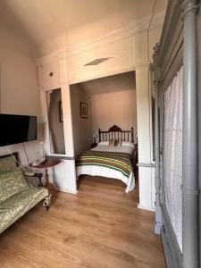 Postel nebo postele na pokoji v ubytování La Casona de Villanueva de Pría