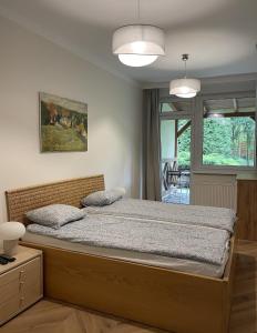 Postel nebo postele na pokoji v ubytování WILLA BOHEMA