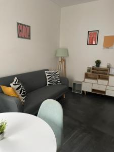 a living room with a couch and a table at Casa Luna 23 in Monopoli