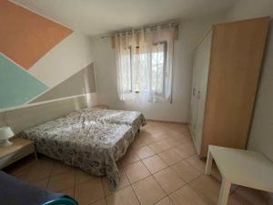 Postel nebo postele na pokoji v ubytování Apartments in Rosolina Mare 24864