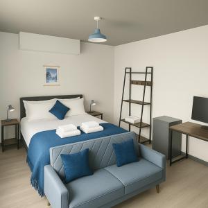 a bedroom with a bed and a chair and a ladder at 1 Bed Flat with King or Twin Beds, Sofa Bed, Work space, Dining and SMART TV with Free Wifi Throughout! in Wingate