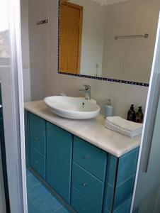 a bathroom with a sink and a mirror at Villa Christina Anidri in Ánidhroi +40 photos