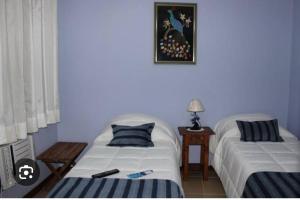 Postel nebo postele na pokoji v ubytování Fênix