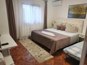 Postel nebo postele na pokoji v ubytování Casa Lac de Verde