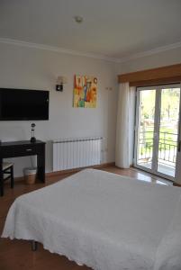 Cama ou camas em um quarto em Hotel Covilhã Jardim