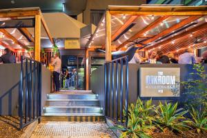 a group of people walking down a set of stairs at Townhouse Hotel in Wagga Wagga