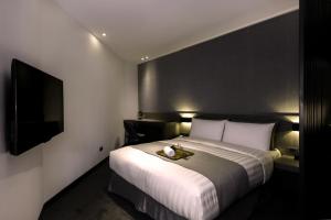 Postelja oz. postelje v sobi nastanitve Wonstar Hotel