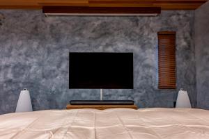 TV i/ili multimedijalni sistem u objektu Sky Villa Beppu -天空の別府邸