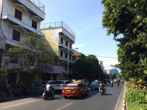 a group of people riding motorcycles down a city street at Hotel O Rungkut Near Its Surabaya Formerly Ace Business Hotel in Surabaya +21 photos