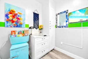 a room with a dresser and a mirror at D- Hip NoHo Haven Hot Tub - Family - Parking in North Hollywood +34 photos