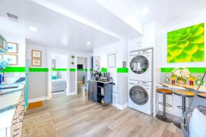 a laundry room with a washer and dryer at D- Hip NoHo Haven Hot Tub - Family - Parking in North Hollywood