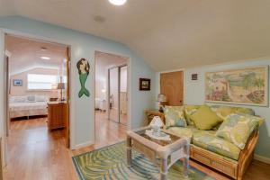 a living room with a couch and a table at Casa de Sueno in Summerland Key +42 photos