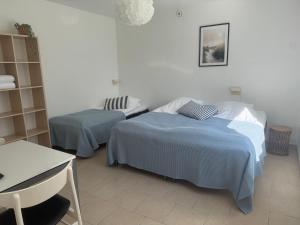 Postel nebo postele na pokoji v ubytování Guesthouse Hune