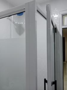 a sliding glass door in a room with white walls at Mimos 2 BR Machakos in Machakos +19 photos