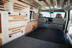 an inside view of an rv with the back doors open at Rent van traffic in Rinas