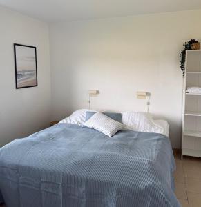 Postel nebo postele na pokoji v ubytování Guesthouse Hune