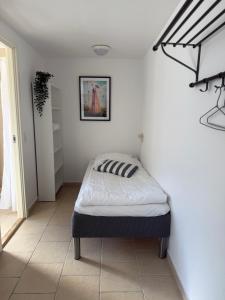 Postel nebo postele na pokoji v ubytování Guesthouse Hune