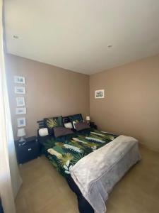 a bedroom with a large bed in a room at L Atelier Demoiselle in Cadillac +23 photos