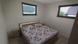 Postel nebo postele na pokoji v ubytování Apartmány Anami + 4 fotografie