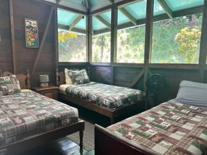 Ένα ή περισσότερα κρεβάτια σε δωμάτιο στο Delfín del Sendero