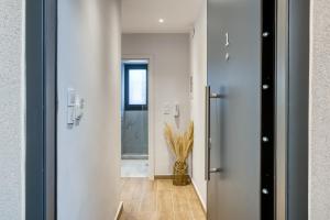 a hallway with a door leading into a room at Virginia Haven 2 in Chios
