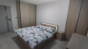Postel nebo postele na pokoji v ubytování Apartmány Anami