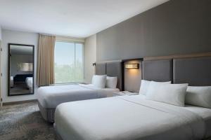 Postel nebo postele na pokoji v ubytování SpringHill Suites by Marriott Austin Cedar Park