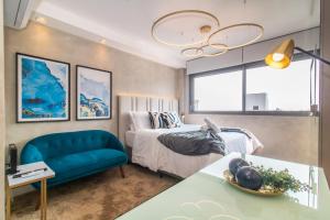 Postel nebo postele na pokoji v ubytování Tempo The Arch - Bela Vista, Auxiliadora, Apartamentos em Porto Alegre