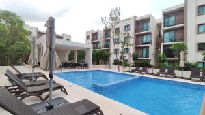 Bazén v ubytování New apartment on the ground floor in CUN nebo v jeho okolí