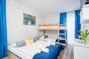 Posteľ alebo postele v izbe v ubytovaní Hotel Nowa Panorama