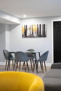 a dining room with a table and chairs at Urban Contemporary Apartment in Providence
