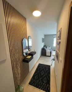 a hallway with a living room with a couch at Appartement Aldapa in Urrugne +6 photos