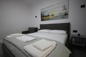 Postel nebo postele na pokoji v ubytování Neranxi Apartament