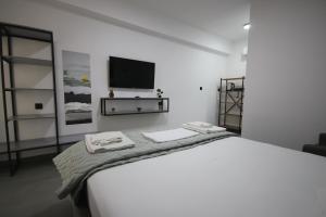 Postel nebo postele na pokoji v ubytování Neranxi Apartament