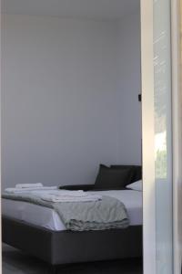 Postel nebo postele na pokoji v ubytování Neranxi Apartament