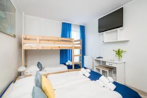 Posteľ alebo postele v izbe v ubytovaní Hotel Nowa Panorama