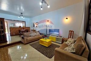 a living room with two couches and a tv at Gran casa, Chalet, con Piscina en Búzios in Buzios
